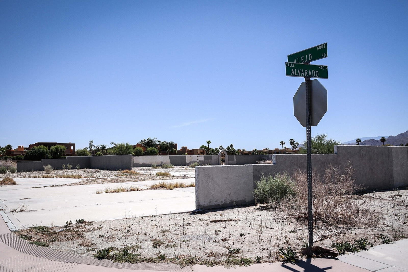 Street signs at Alejo Road and Calle Alvarado in Palm Springs, California